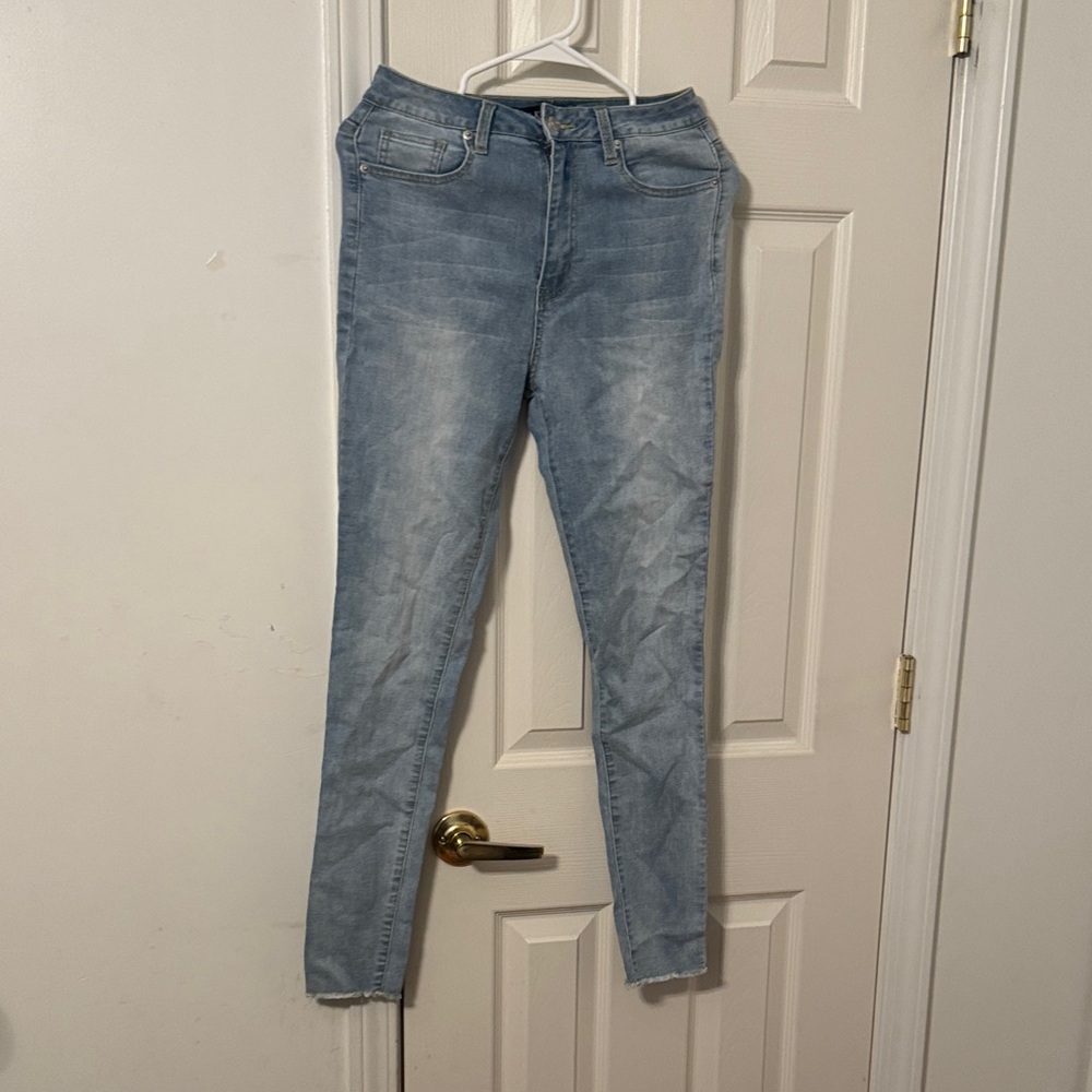 AKIRA Light Wash Skinny Jeans with Bedazzled Back Pocket